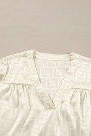 Long sleeve V-neck blouse in 100% polyester jacquard