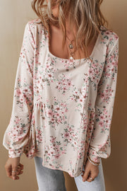 Pink floral blouse in soft pink with romantic puff sleeves