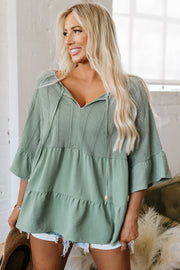 Laurel green ruffle blouse in 97% polyester low-stretch fabric