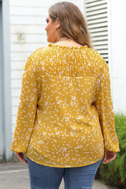 Plus size floral blouse with long sleeves and relaxed shift fit