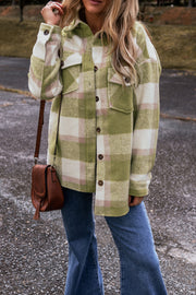 Plaid baggy shacket with two flap chest pockets, worn open as a light jacket