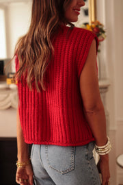 Sleeveless red sweater vest with button front and round neckline