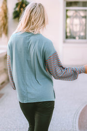 Green striped colorblock top with elegant bishop sleeves and shift silhouette