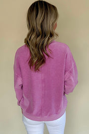 Relaxed-fit long sleeve pullover sweatshirt with notched neckline detail