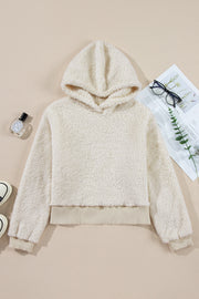 Solid white plush hoodie with contrast ribbed trim close-up