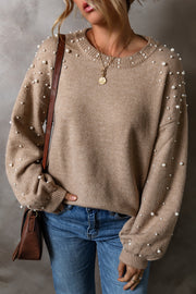 Evergreen Sweater close-up of delicate beaded pearl accents