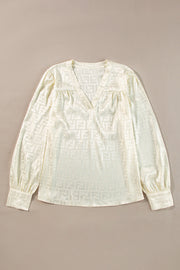 Gathered bishop sleeves on oatmeal long sleeve blouse