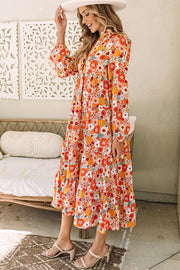 Floral long sleeve dress with flowing flared hem in floor-length style