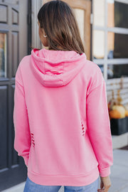 Ripped pink hoodie with long sleeves and front kangaroo pocket