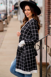 Plaid open-front cardigan with long sleeves and relaxed shift silhouette