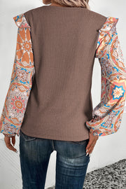 Long sleeve waffle knit blouse with round neck and relaxed shift fit