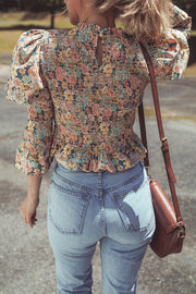 Floral crop top showing high-stretch smocked back panel