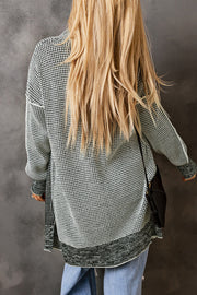 Loose fit plaid knit cardigan with long sleeves and tunic length