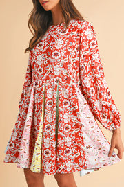 Red floral patchwork mini dress with long sleeves and pleated skirt