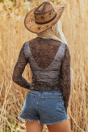 Rodeo print long sleeve top with round neck and sheath silhouette