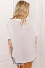 White long sleeve floral top with layered two-piece look and relaxed shift fit