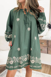 Mist green floral dress with V neck and tie neck finish