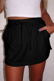 High drawstring waistband detail on black French terry skort