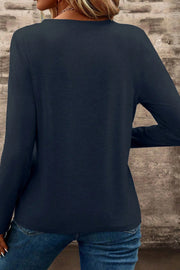Dirty blue long sleeve tee showing notched V-neckline detail