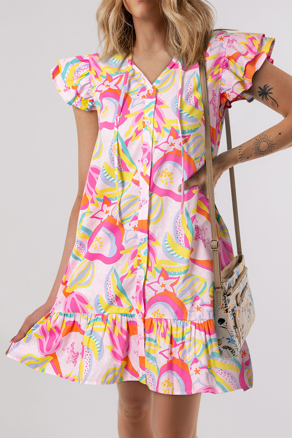 Pink abstract floral flutter sleeve mini dress with ruffle trim