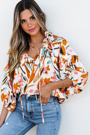 Frilled V-neck blouse in easy shift silhouette