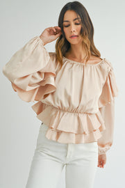Round neck peplum blouse with lace-up keyhole back accent