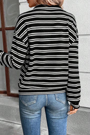 Textured quarter zip top showing relaxed drop shoulder cut
