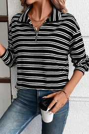 Casual quarter zip long sleeve top styled with black jeans