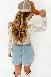 Beige lace high neck top showing fitted slim body and stretchy ribbed fabric
