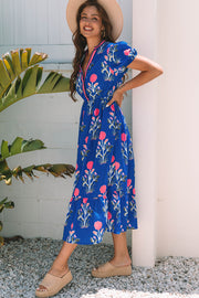 Long floral maxi dress featuring striped trim V-neckline