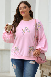 Embroidered bow sweatshirt showing voluminous lantern sleeve detail