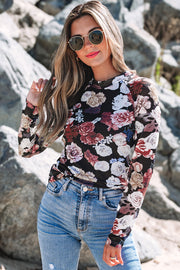 Sheer long sleeve detail of pink floral mock neck top