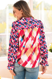 Lightweight 100% polyester blouse styled with a neat stand neckline