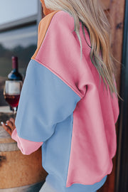 Pink drop-shoulder sweatshirt styled for everyday wear