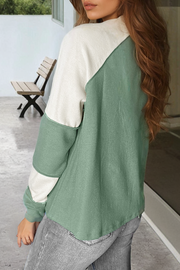 Mint green raglan top showing patchwork color block design