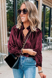 Burgundy velvet top showing frilled round neckline detail
