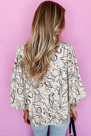 Long sleeve abstract print blouse with soft romantic shape