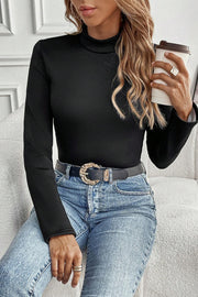 Black mock neck tee showing slightly longer back hem detail