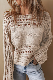 Cotton-blend cropped sweater styled over high-waisted bottoms