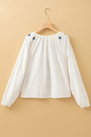 Long sleeve embroidered white top styled for daily wear