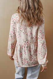 Floral pleated blouse showing flattering U-neckline detail