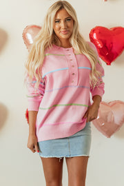 Pink rainbow stripe Henley sweater with button placket neckline