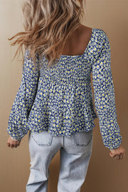 Floral square neck blouse showing smocked shirred panel detail