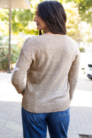 Star pattern drop shoulder sweater showing relaxed shift silhouette and long sleeves