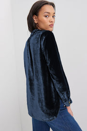 Burgundy velvet frilled neck top close-up on button front