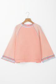 Raglan top with contrast stripe stitching and waffle knit panels