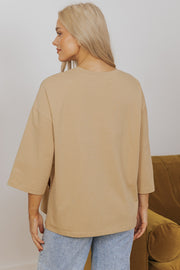 Camel Star Patchwork Top showing 3/4 bracelet-length sleeves