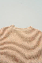 Loose sweater featuring subtle side slits for easy movement