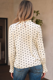 Polka dot lantern sleeve blouse with ruffled round neckline