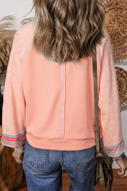 Waffle knit raglan long sleeve top with wide bracelet sleeves